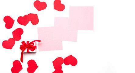 valentines day. letter. gift box with blank sheet for love message and red hearts on a white background with copy space. Top View.