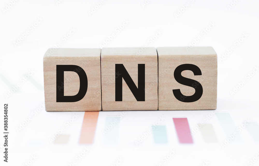 Poster dns, domain name system on the table against the background of colored charts