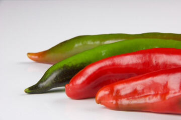 part of multicolored peppers isolated on white