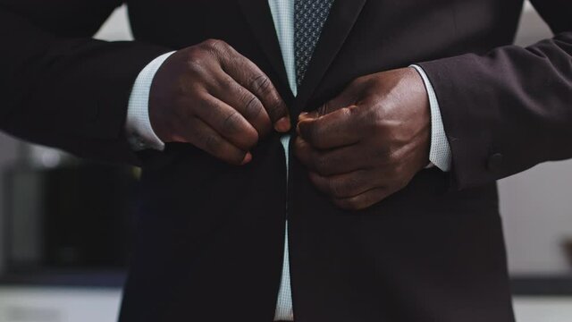 Hands of an Elegant Black African Business Man Button Up His Suit, Close Up Slow Motion