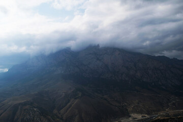 View of the mountains of the North Caucasus. Mountains in the clouds in summer