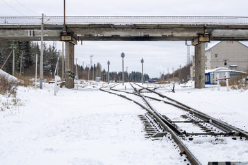 Railway in winter. Snow-covered railway tracks.