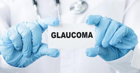 Doctor holding a card with text Glaucoma medical concept