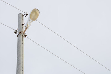 Street light. Street lighting post with wires.