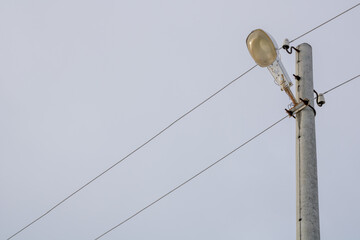 Obraz premium Street light. Street lighting post with wires.
