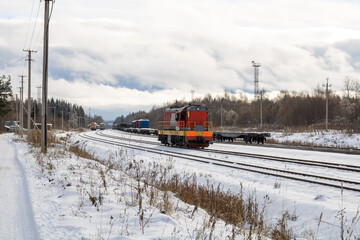 Train in winter. Old diesel locomotive on the railway.