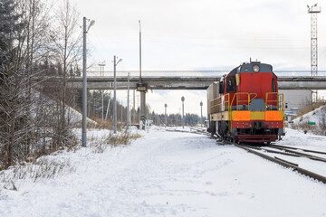 Train in winter. Old diesel locomotive on the railway.