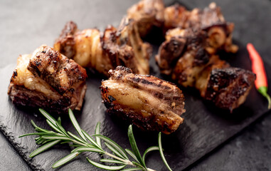 grilled beef ribs on a stone background