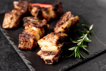 grilled beef ribs on a stone background