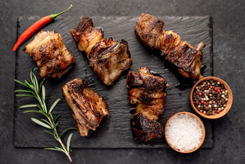 grilled beef ribs on a stone background