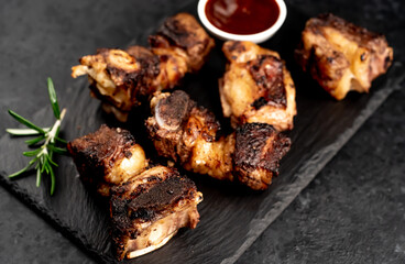 grilled beef ribs on a stone background