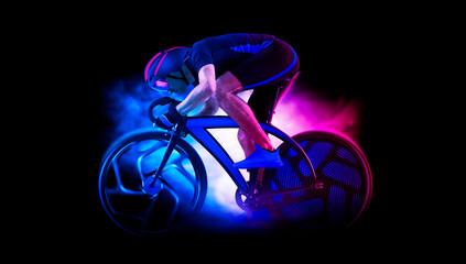 Man racing cyclist in motion on smoke background. Sports banner
