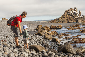 Dad and son on Cobble Beach near Yaquina Head © ansyvan