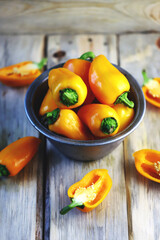 Selective focus. Yellow sweet peppers in a bowl. Paprika harvest.