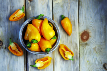 Selective focus. Yellow sweet peppers in a bowl. Paprika harvest.