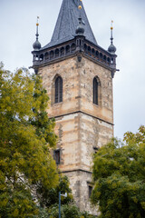 Gothic tower of the medieval New Town Hall (Novomestska radnice) at Charles Square in the center of Prague during the autumn day, Czech Republic, Bohemia region