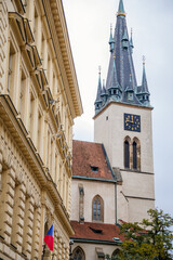 Gothic tower of the medieval Church of St. Stepan in the center of Prague during the autumn day, Czech Republic