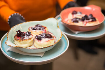 Cheesecake with berry jam are on the plate