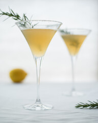 Lemon drop martini cocktail with rosemary