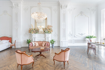 royal baroque style luxury posh interior of large room. extra white, full of day light. high ceiling and walls decorated by stucco