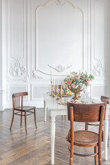 royal baroque style luxury posh interior of large room. extra white, full of day light. high ceiling and walls decorated by stucco
