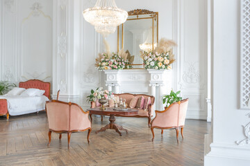 royal baroque style luxury posh interior of large room. extra white, full of day light. high ceiling and walls decorated by stucco