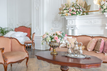 royal baroque style luxury posh interior of large room. extra white, full of day light. high ceiling and walls decorated by stucco