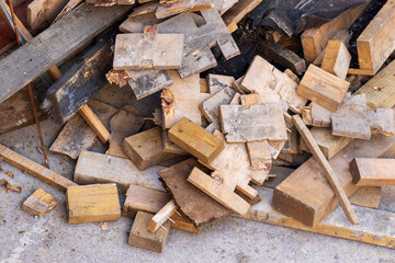 Pile of timber wood off cuts or offcuts on building construction site. Carpentry background