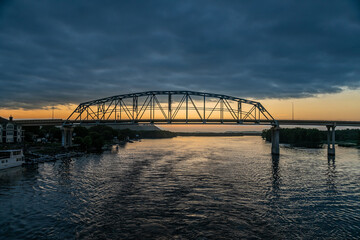 The Wabasha Nelson Bridge Over the Mississippi River at Sunset on a Cloudy Day, As Seen From a Riverboat