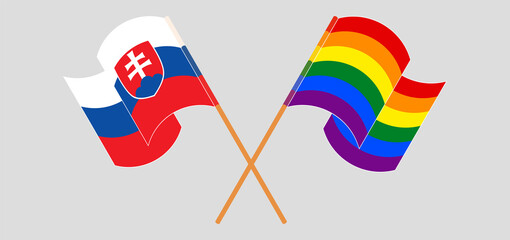 Crossed and waving flags of LGBTQ and Slovakia