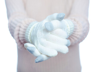 Woman hands in white winter warm gloves on white background isolation