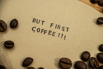 But first coffee slogan on coffee filter with stamps and beans