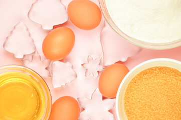 food and utensils on a pink background