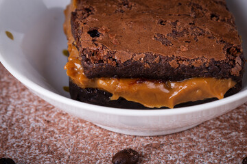 Chocolate brownie with delicious dulce de letche filling. Closeup photography.