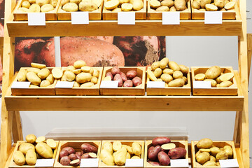 Different varieties of potatoes on shop