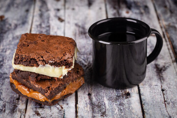 Chocolate brownie with milk powder delicious filling. Closeup photography.