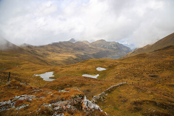 High up in the Austrian Alps in foggy weather on overcast day