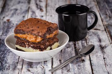 Chocolate brownie with milk powder delicious filling. Closeup photography.