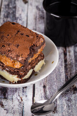 Chocolate brownie with milk powder delicious filling. Closeup photography.