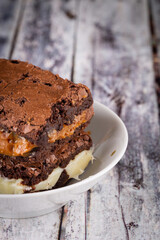 Chocolate brownie with milk powder delicious filling. Closeup photography.