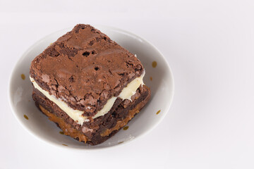 Chocolate brownie with milk powder delicious filling. Closeup photography.