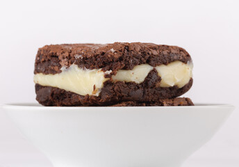 Chocolate brownie with milk powder delicious filling. Closeup photography.