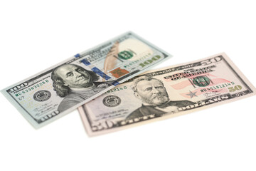 100 Dollars bill and portrait Benjamin Franklin on USA money banknote. Hundred dollar bills on wooden background..