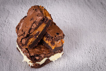 Chocolate brownie with delicious filling. Closeup photography.