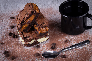 Chocolate brownie with delicious filling. Closeup photography.