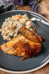 Roast chicken served with russian traditional salad.