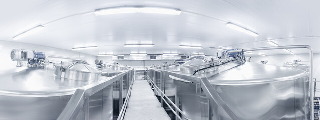 Banner plant milk factory industry. Stainless steel storage and processing tanks
