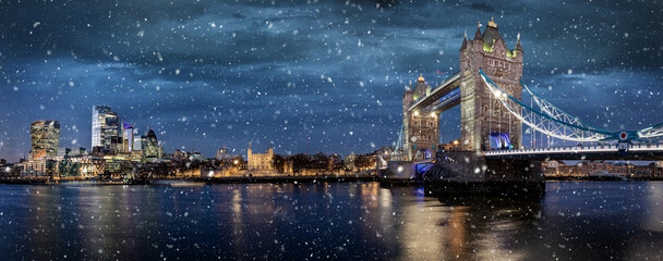 Panoramic view of the illuminated skyline of London, United Kingdom, during winter night time with...