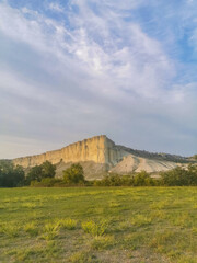 Fototapeta na wymiar White rock in the Crimea. White rock Sights of Crimea. High rock Rocky mountain. White rock against a beautiful sunset