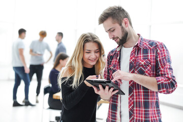 young colleagues with business documents standing together.